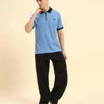 Model wearing the Sky Blue Premium Classic Fit Rib Knit Polo styled with dark trousers - Men's sophisticated casual look.