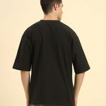 Back view of the Aeternum Men's Oversized Jacquard T-Shirt in Dark Green, demonstrating the clean and loose fit.