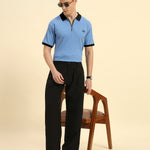 Lifestyle view of the Sky Blue Aeternum Premium Classic Fit Rib Knit Polo showcasing the shirt's refined drape and comfort.