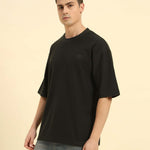 Three-quarter profile of the Men's Dark Green Aeternum Jacquard T-Shirt highlighting the premium fabric drape