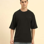 Aeternum Men's Oversized Jacquard Round Neck T-Shirt in Dark Green - Front view showing the relaxed, boxy silhouette.