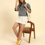 Woman wearing AE oversized French terry t-shirt for women in dark grey with a casual outfit.