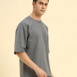 Three-quarter profile of the Men's Dark Grey Aeternum French Terry T-Shirt highlighting the soft, textured knit.