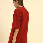 Side profile of the Red Oversized Cotton Slub V-Neck T-Shirt highlighting the loose silhouette and lightweight fabric