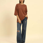 Oversized Waffle Knit Round Neck T-Shirt | Coffee Brown | Woman worn with ripped jeans on model.