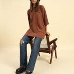 Oversized Waffle Knit Round Neck T-Shirt | Coffee Brown | Woman worn with casual jeans and a bucket hat.