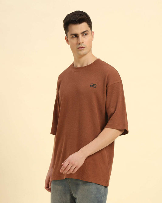 Three-quarter profile of the Men's Coffee Brown Aeternum Waffle Knit T-Shirt highlighting the premium textured drape.