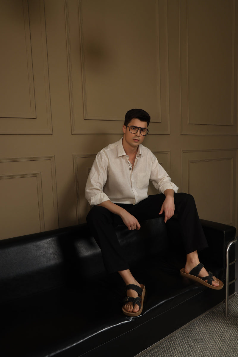 Man wearing a light blue shirt from the collection of men's linen shirts, showcasing comfort and style.