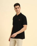 Three-quarter profile of the Men's Black Aeternum Cotton Polo highlighting the structured collar and premium piqué fabric