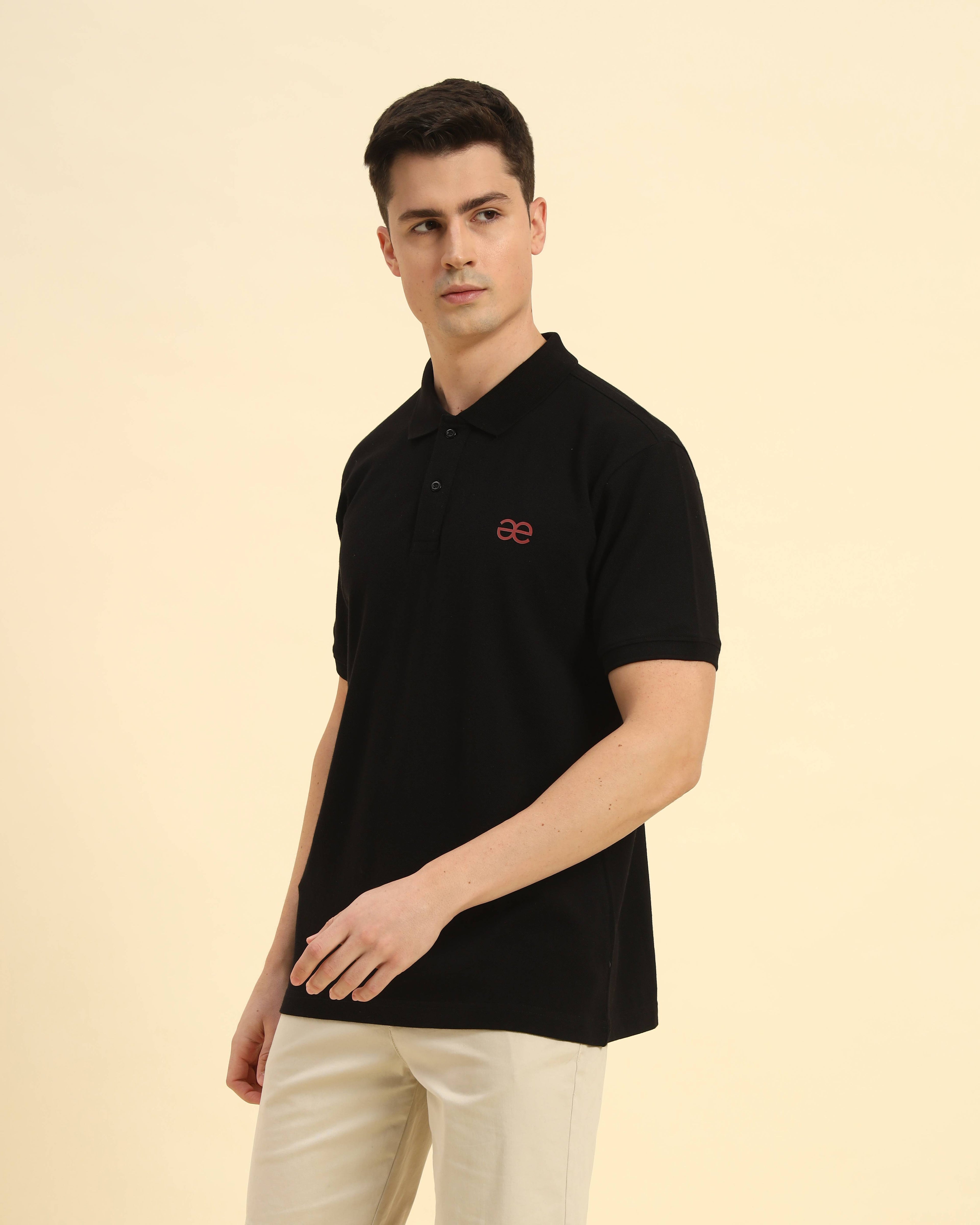 Three-quarter profile of the Men's Black Aeternum Cotton Polo highlighting the structured collar and premium piqué fabric