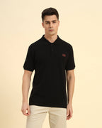 Aeternum Premium Classic Fit Men’s Cotton Polo in Black - Front view showing the sharp, tailored silhouette.