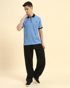 Model wearing the Sky Blue Premium Classic Fit Rib Knit Polo styled with dark trousers - Men's sophisticated casual look.