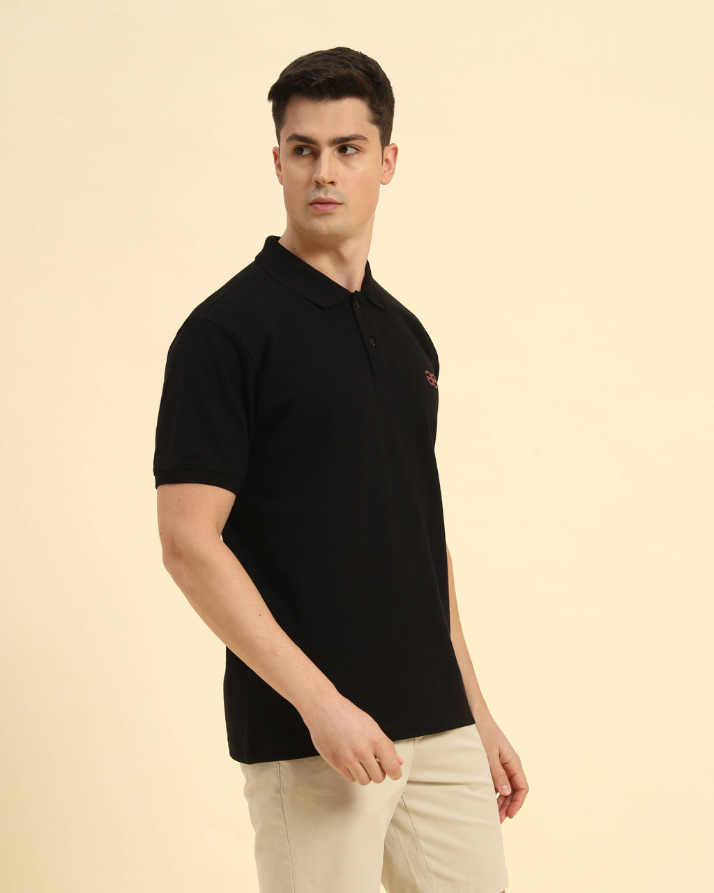 Standing view of the Aeternum Men's Black Cotton Polo showcasing the refined fit and breathable cotton texture