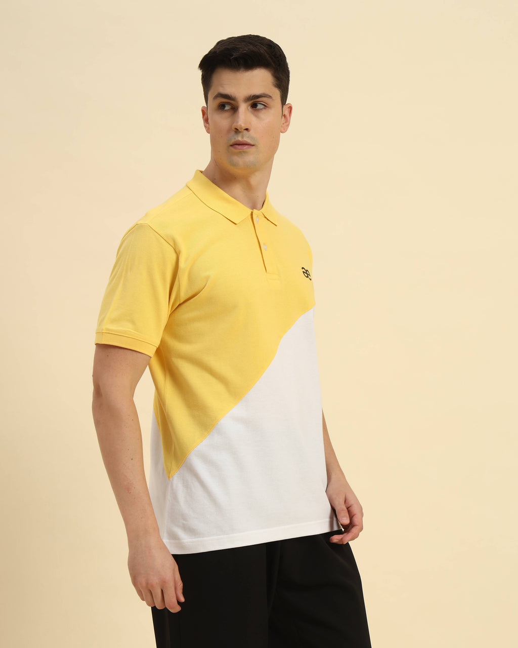 Three-quarter profile of the Men's Yellow & White Aeternum Cotton Polo highlighting the crisp collar and premium piqué fabric.