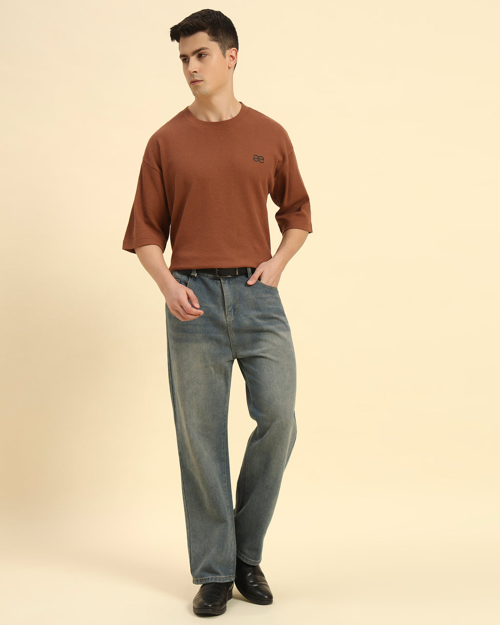 Full body view of the Coffee Brown Aeternum Waffle Knit T-Shirt styled with denim for a modern aesthetic.