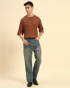 Full body view of the Coffee Brown Aeternum Waffle Knit T-Shirt styled with denim for a modern aesthetic.