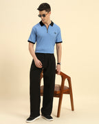 Lifestyle view of the Sky Blue Aeternum Premium Classic Fit Rib Knit Polo showcasing the shirt's refined drape and comfort.