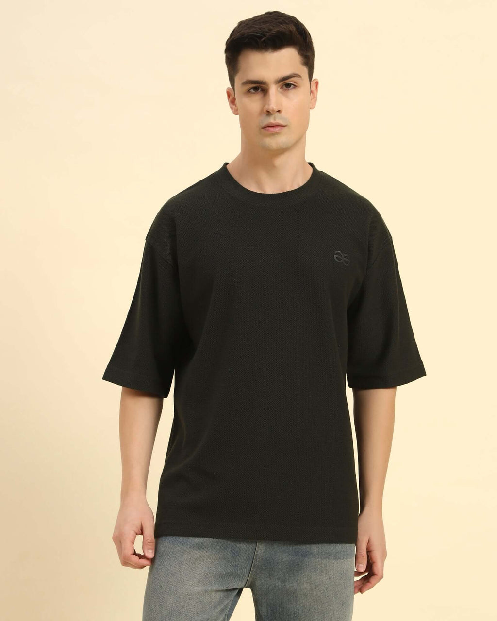 Aeternum Men's Oversized Jacquard Round Neck T-Shirt in Dark Green - Front view showing the relaxed, boxy silhouette.