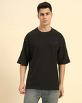 Aeternum Men's Oversized Jacquard Round Neck T-Shirt in Dark Green - Front view showing the relaxed, boxy silhouette.