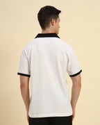 Back view of the Aeternum Men's White Cotton Polo highlighting the clean, structured shoulder line.