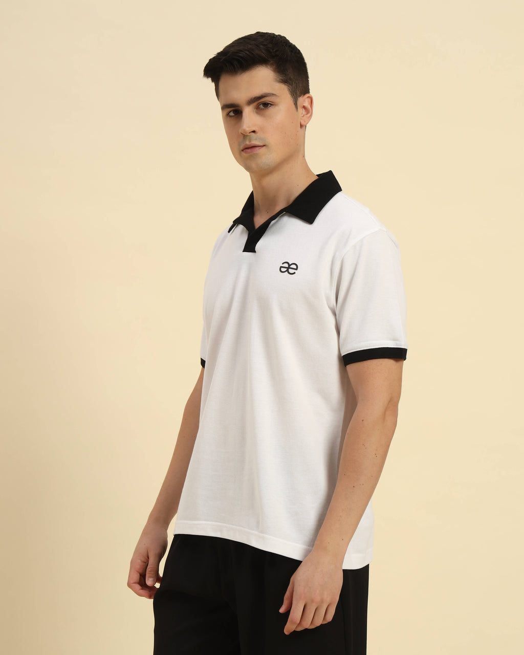 Side view of the Aeternum Men's White Cotton Polo showcasing the refined sleeve length and classic fit.