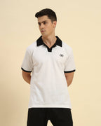 Front view of the White Premium Classic Fit Cotton Polo on model, demonstrating a sophisticated casual look