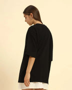 Side profile of the Aeternum Women's Oversized T-Shirt in Black, highlighting the heavyweight cotton drape.