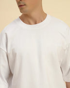 Close-up of the ribbed crew neckline and premium French terry knit on the Aeternum Men's White T-Shirt.