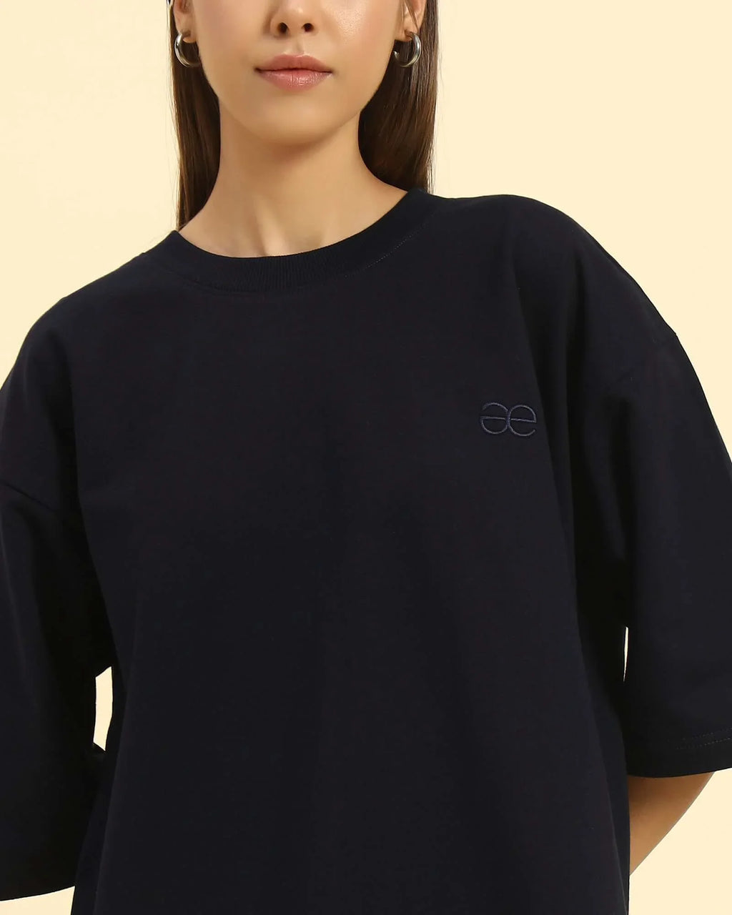 Close-up of the crew neckline and premium French terry texture on the Aeternum Women's Navy Blue T-Shirt