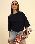 Lifestyle view of the Women's Aeternum Oversized French Terry T-Shirt in Navy Blue showing a comfortable, relaxed fit