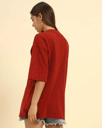 Side profile of the Red Oversized Cotton Slub V-Neck T-Shirt highlighting the loose silhouette and lightweight fabric