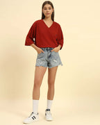 Model wearing the Red Aeternum Cotton Slub T-Shirt styled with denim shorts - Women's casual oversized fit