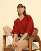 Lifestyle view of the Red Aeternum Women's Cotton Slub T-Shirt showing a comfortable, relaxed aesthetic