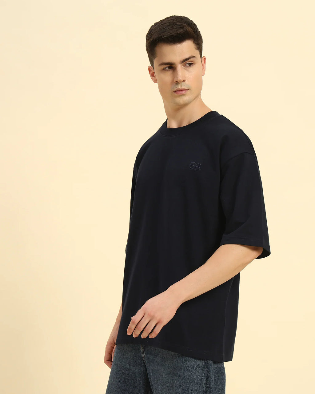 Three-quarter profile of the Men's Navy Blue Aeternum French Terry T-Shirt highlighting the premium heavyweight cotton drape.