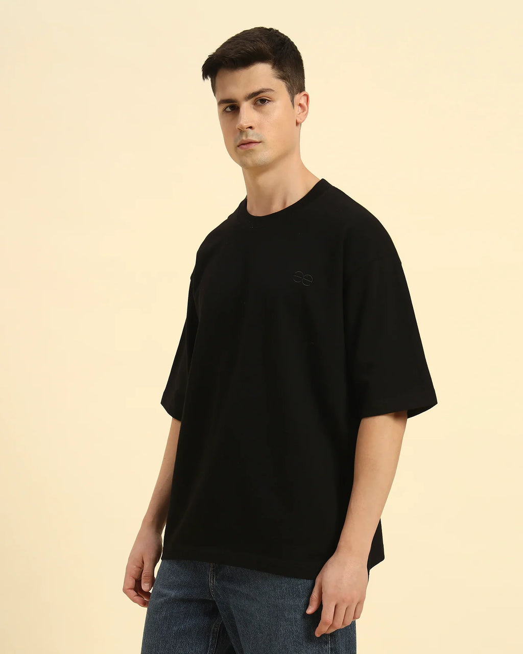 Three-quarter profile of the Men's Black Aeternum French Terry T-Shirt highlighting the heavy-weight cotton drape.