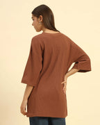 Oversized Waffle Knit Round Neck T-Shirt | Coffee Brown | Woman, back view showcasing relaxed fit and texture.