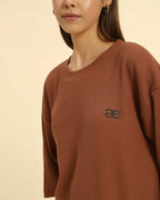 Oversized Waffle Knit Round Neck T-Shirt | Coffee Brown | Woman, showcasing relaxed fit and waffle knit texture.
