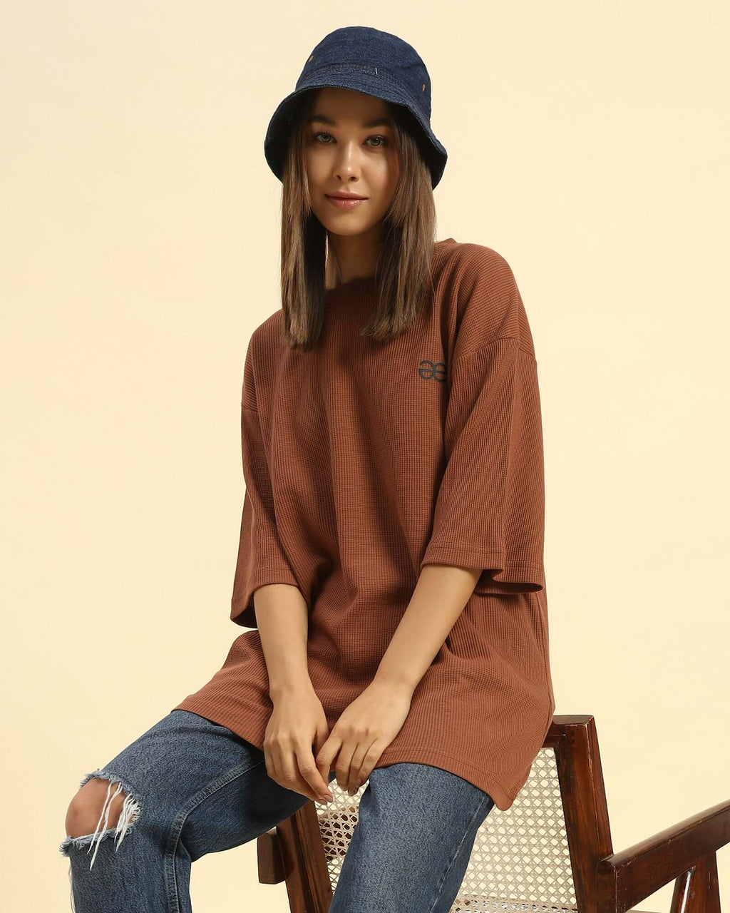 Oversized Waffle Knit Round Neck T-Shirt | Coffee Brown | Woman worn by young woman sitting on a chair.