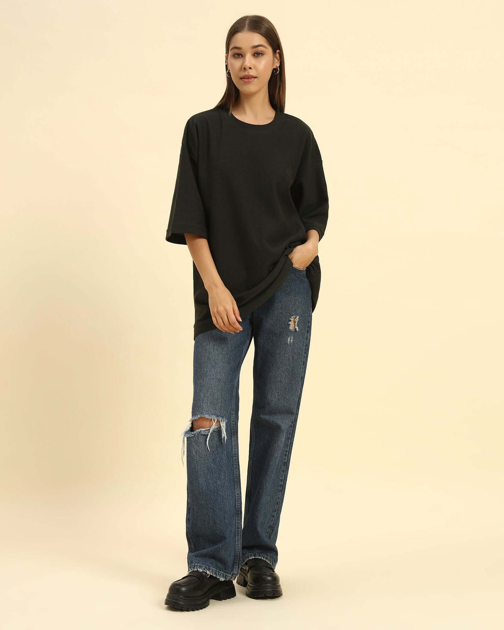 Model wearing the Dark Green Aeternum Jacquard T-Shirt styled with denim jeans - Women's casual oversized streetwear look