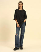 Model wearing the Dark Green Aeternum Jacquard T-Shirt styled with denim jeans - Women's casual oversized streetwear look