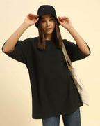 Lifestyle view of the Women's Aeternum Oversized Jacquard T-Shirt in Dark Green showing a comfortable, relaxed fit.