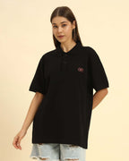 Aeternum Premium Classic Fit Women’s Cotton Polo in Black - Front view showing the refined tailored silhouette