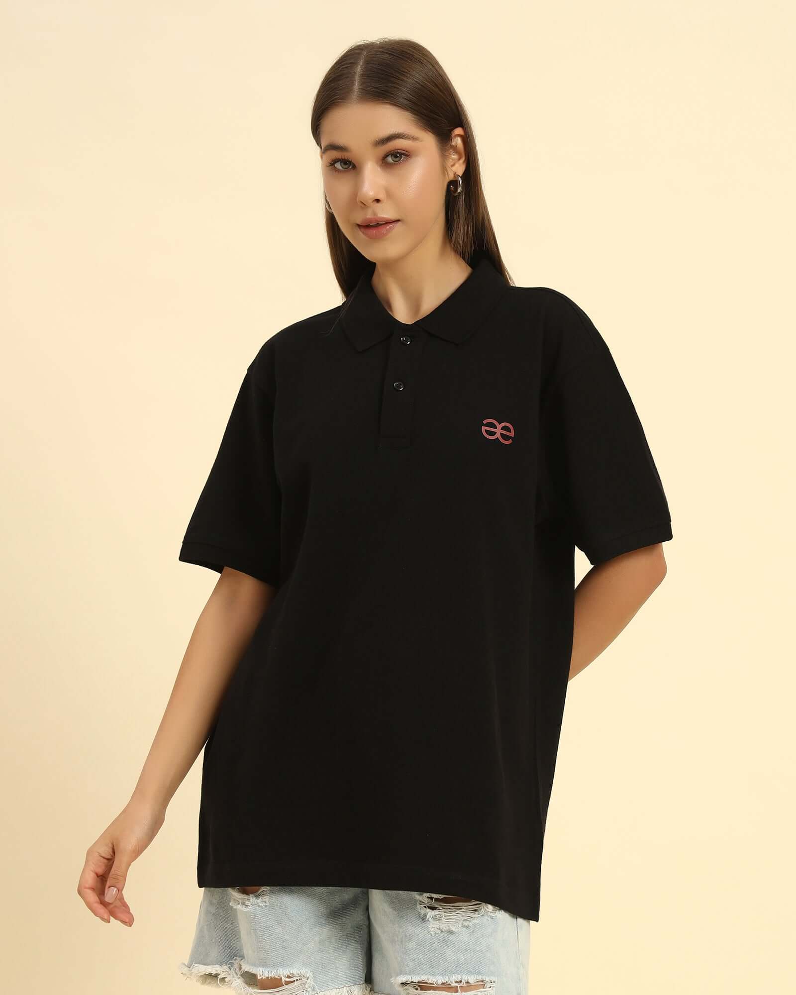 Aeternum Premium Classic Fit Women’s Cotton Polo in Black - Front view showing the refined tailored silhouette