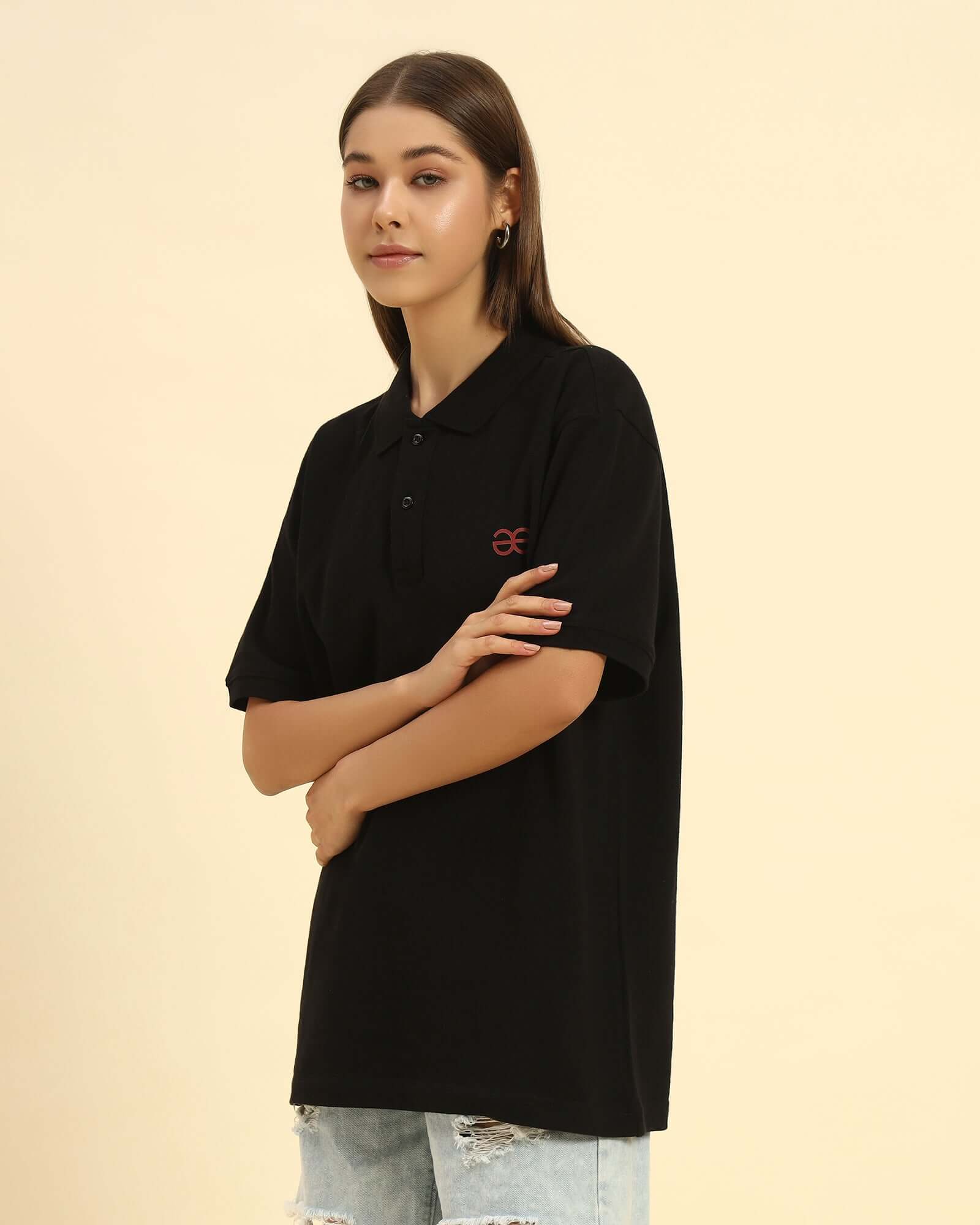 Three-quarter profile of the Black Aeternum Women's Cotton Polo highlighting the crisp collar and premium fabric