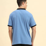 Back view of the Aeternum Men's Sky Blue Rib Knit Polo demonstrating the clean, classic silhouette.