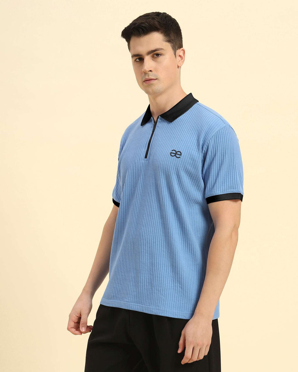 Three-quarter profile of the Men's Sky Blue Aeternum Rib Knit Polo highlighting the structured collar and premium texture.