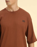 Close-up of the round neckline and intricate waffle knit pattern on the Aeternum Men's Coffee Brown T-Shirt.