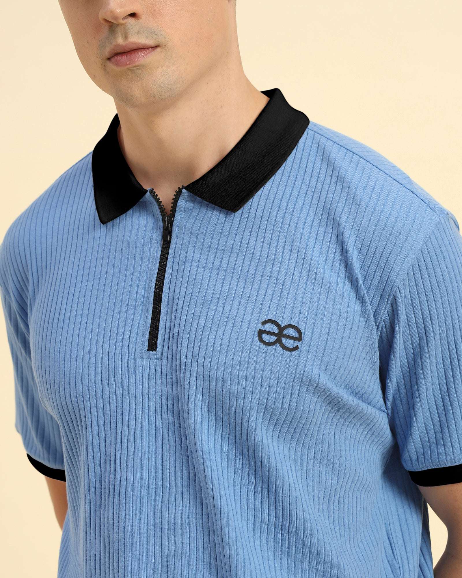 Close-up of the contrasting collar and intricate rib knit pattern on the Aeternum Men's Sky Blue Polo.