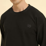 Close-up of the round neckline and intricate jacquard knit texture on the Aeternum Men's Dark Green T-Shirt.