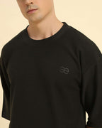 Close-up of the round neckline and intricate jacquard knit texture on the Aeternum Men's Dark Green T-Shirt.